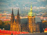 St Vitus Cathedral - landmark of Prague Castle historical complex. Aerial view from Petrin Hill Lookout Tower in the evening sunset time. Prague capital city of Czech Republic, Europe. UNESCO World Heritage Site